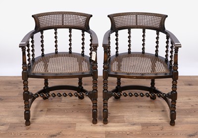 Lot 151 - A pair of early 20th Century stained beech and canework armchairs