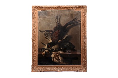 Lot 30 - Follower of Jean-Baptiste Oudry - A pheasant, a duck, and other game birds on a ledge | oil
