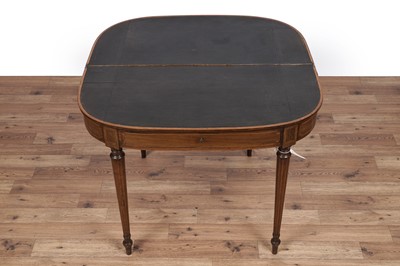 Lot 84 - An Edwardian inlaid and banded mahogany games table