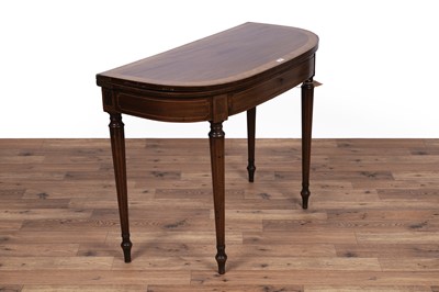 Lot 84 - An Edwardian inlaid and banded mahogany games table