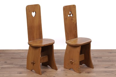 Lot 55 - An unusual and distinctive elm dining table and six chairs