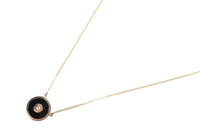 Lot 890 - Cartier, Paris: an onyx and diamond pendant