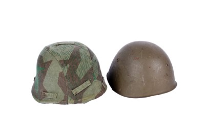 Lot 198 - A German M40 pattern helmet and an American helmet