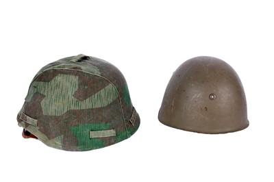 Lot 198 - A German M40 pattern helmet and an American helmet