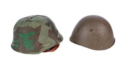 Lot 198 - A German M40 pattern helmet and an American helmet