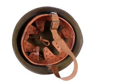 Lot 198 - A German M40 pattern helmet and an American helmet