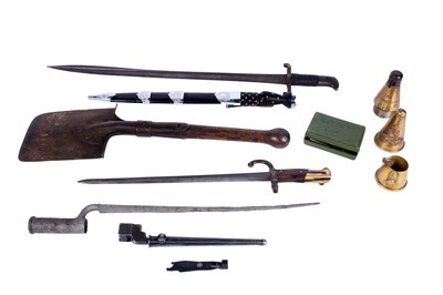 Lot 121 - A First World War Imperial German trench shovel; and other military items