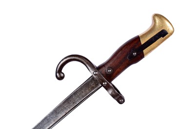 Lot 121 - A First World War Imperial German trench shovel; and other military items
