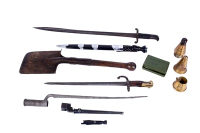 Lot 121 - A First World War Imperial German trench shovel; and other military items