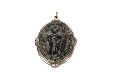 Lot 755 - Maureen Costain Richards: a carved hardstone pendant of Celtic design