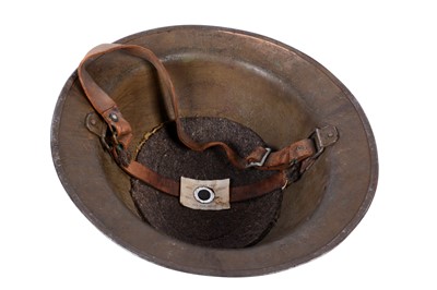 Lot 191 - Two Brodie helmets; and another