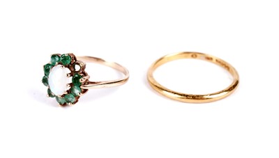 Lot 24 - A 22ct yellow gold wedding band; and an opal and emerald cluster ring