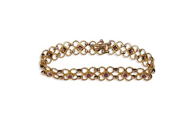 Lot 645 - A ruby and 15ct yellow gold bracelet
