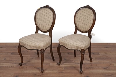 Lot 26 - A set of four Victorian carved walnut salon chairs