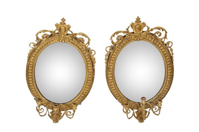 Lot 181 - A pair of George III giltwood girandole mirrors