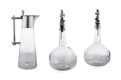 Lot 513 - A late 19th Century German claret jug; and a pair of Robbie Burns glass decanters