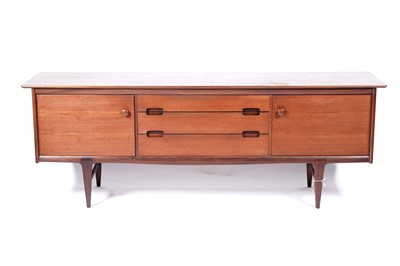 Lot 59 - A mid-20th Century teak and Afromosia matched dining room suite