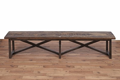 Lot 17 - An industrial style oak dining table and bench