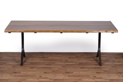Lot 17 - An industrial style oak dining table and bench