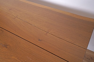 Lot 17 - An industrial style oak dining table and bench