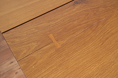 Lot 17 - An industrial style oak dining table and bench