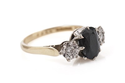 Lot 747 - A sapphire and diamond three stone ring