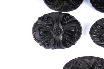 Lot 1492 - Nine Victorian Etruscan revival jet and faux jet brooches