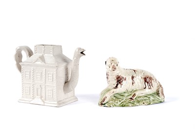 Lot 1081 - A salt-glaze teapot; and a Ralph Wood sheep