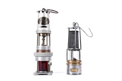 Lot 1442 - Two miners’ lamps; and another