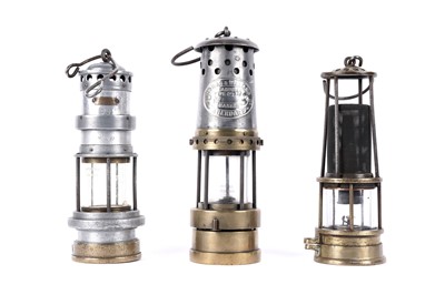 Lot 1443 - Three miners’ lamps; together with a Clanny style lamp