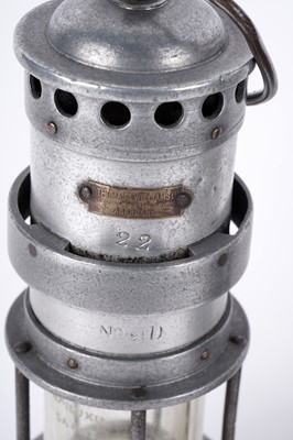 Lot 1443 - Three miners’ lamps; together with a Clanny style lamp