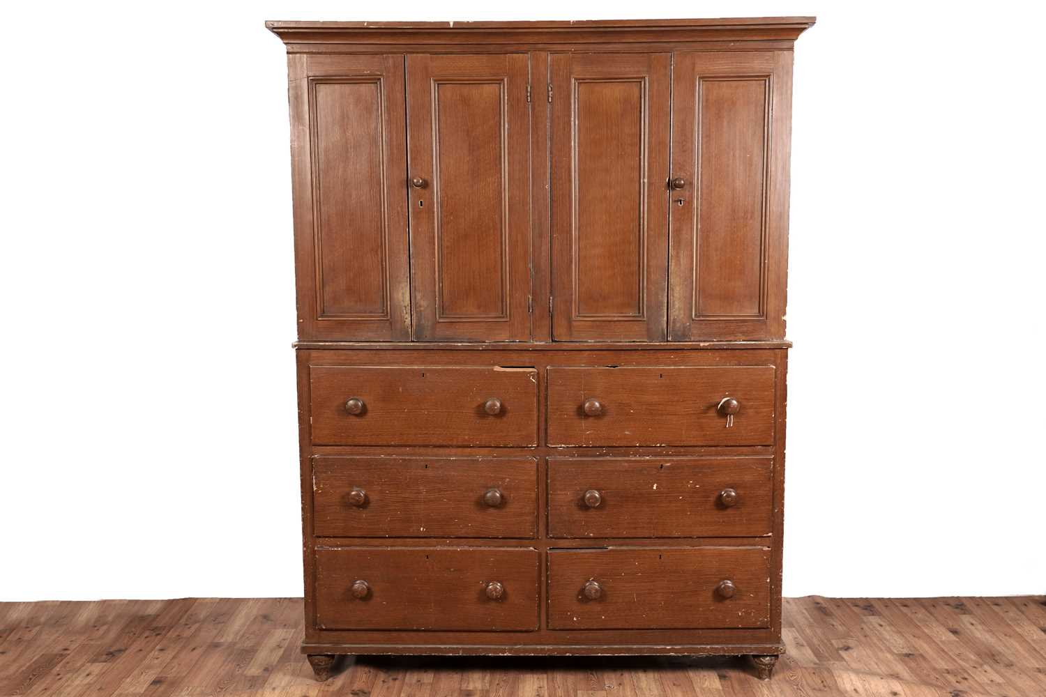 Lot 412 - A Victorian scumbled pine housekeeper’s cabinet