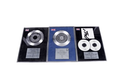Lot 609 - Three framed presentation discs