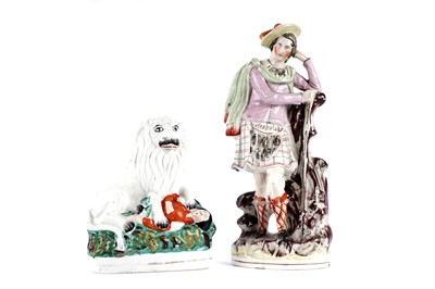 Lot 1091 - A Staffordshire flatback figure of a lion and Napoleon; and another of a Highlander