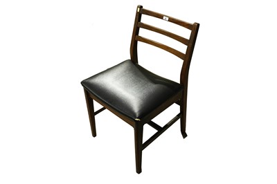 Lot 36 - A mid-20th Century teak extending dining table and six dining chairs