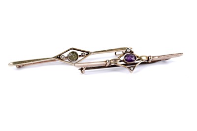 Lot 24 - An amethyst and seed pearl bar brooch; and another