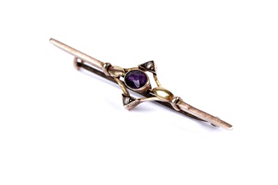 Lot 24 - An amethyst and seed pearl bar brooch; and another