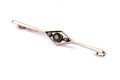 Lot 24 - An amethyst and seed pearl bar brooch; and another