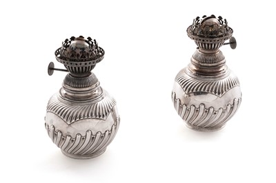 Lot 534 - A pair of late Victorian/Edwardian silver lamps