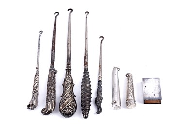 Lot 555 - Victorian and later silver-handled buttonhooks; and others