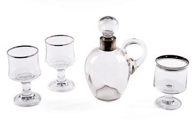 Lot 410 - An early 20th Century silver collared glass decanter and three goblets