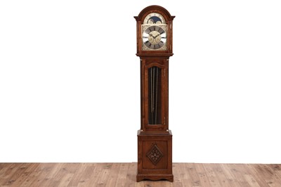 Lot 599 - Comitti, London: a 20th Century carved oak 30-hour longcase clock