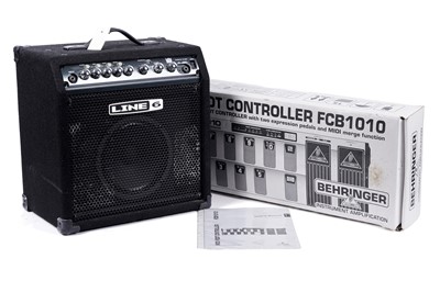 Lot 601 - A boxed Behringer Midi foot controller; and a bass amplifier