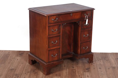 Lot 461 - A substantial Georgian style mahogany kneehole desk