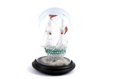 Lot 403 - ﻿A late 19th Century spun glass frigger﻿ in the form of a ship, in glass dome