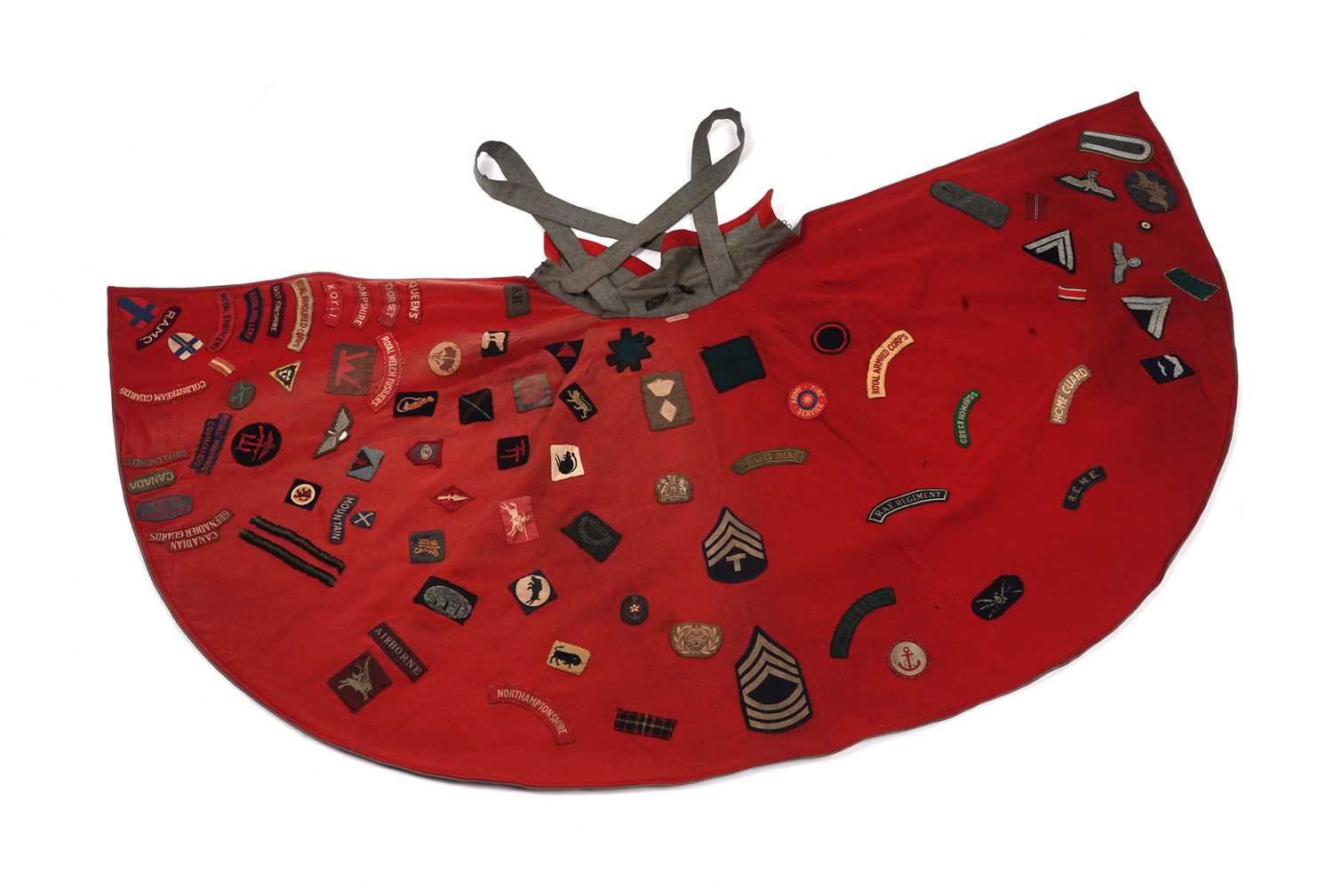 Lot 330 - A Nurse's cape, stitched with regimental cloth badges