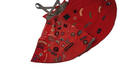 Lot 330 - A Nurse's cape, stitched with regimental cloth badges