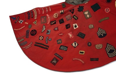 Lot 330 - A Nurse's cape, stitched with regimental cloth badges