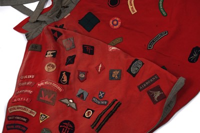 Lot 330 - A Nurse's cape, stitched with regimental cloth badges