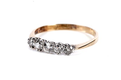 Lot 737 - A five stone diamond ring
